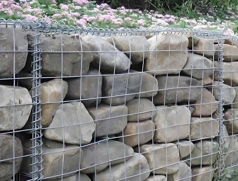 Welded gabions are stone-filled steel mesh cages for retaining walls and decorative landscaping.